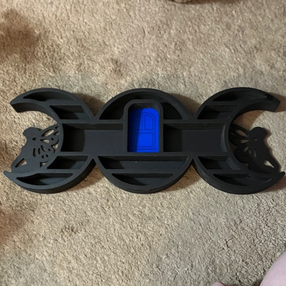 Black and Blue Wall Decor with Butterfly Design. Small shelf for crystals.